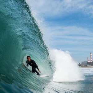 A surfer getting barreled at Rosecrans in El Porto Manhattan Beach Los Angeles